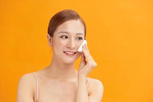 woman face cotton pad skin photo