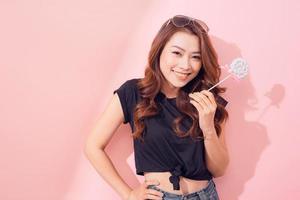 young asian woman with lolipop photo