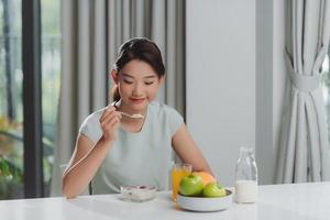 Pretty girl, happy meal eating healthy breakfast in morning, photo