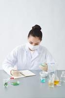 the scientist, dermatologist formulate organic natural cosmetic product in the laboratory photo