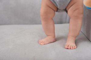 Close up of the charming small legs doing the first steps photo