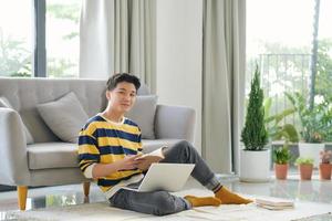 Man drawing in notebook at online lesson indoors. Distance learning photo