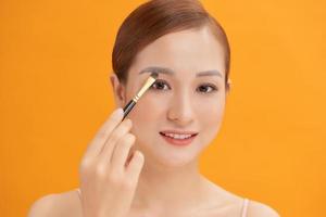 Beauty Asian Girl with Cosmetics Makeup. photo