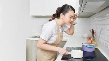 Young woman cooking in the kitchen. Healthy food. photo