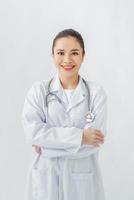 Woman in medical gown, stethoscope in consulting room photo