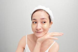 Spa skin care beauty woman wearing hair towel after beauty treatment photo