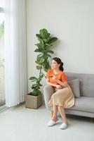 Attractive mixed female lifestyle drinking a cup of tea looking out photo