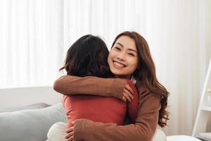 Young couple smiling happy and hugging sitting on the bed. photo