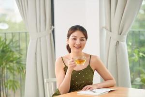 Woman with books at the table photo