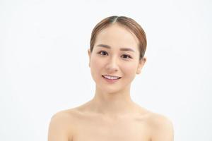 Portrait of young Asian woman with natural skin on white background. photo