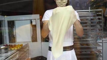 Professional baker preparing dough