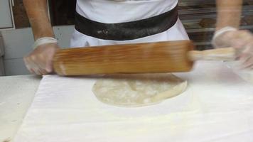 Professional baker preparing dough