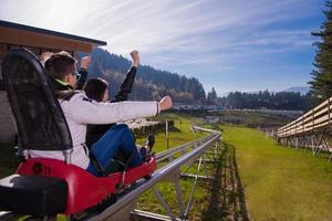 Sweden, 2022 - couple driving on alpine coaster photo