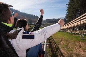 Sweden, 2022 - couple enjoys driving on alpine coaster photo