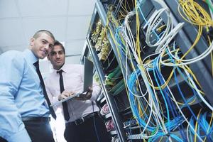 it engineers in network server room photo