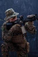 soldier in action aiming laseer sight optics photo