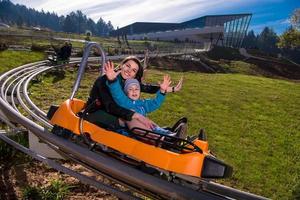 Croatia, 2022 - young mother and son driving alpine coaster photo