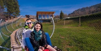 Sweden, 2022 - couple driving on alpine coaster photo