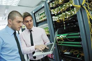 it engineers in network server room photo