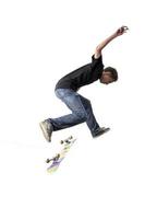 Boy practicing skate in a skate park - isolated photo