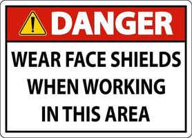 Danger Wear Face Shields In This Area Sign On White Background vector