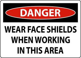 Danger Wear Face Shields In This Area Sign On White Background vector