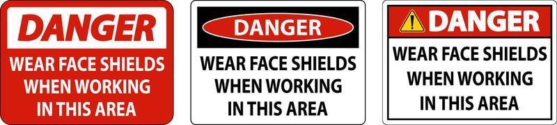 Danger Wear Face Shields In This Area Sign On White Background vector