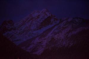 mountain village in alps  at night photo