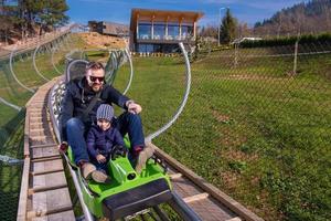 Croatia, 2022 - young father and son driving alpine coaster photo