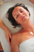 beautiful woman have massage at spa and wellness center photo