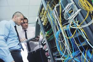 it engineers in network server room photo