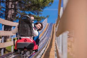 Croatia, 2022 - couple driving on alpine coaster photo