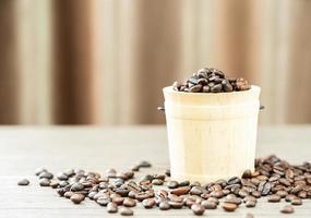 Coffee beans in wood bucket photo