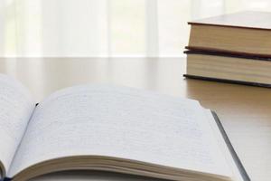 Notebook on wood table photo