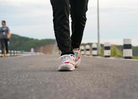 Close up of girl shoes walking photo