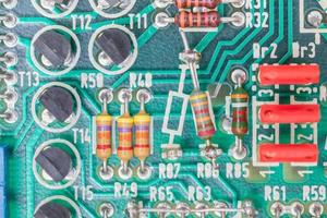 Condensers and Resistor assembly on the circuit board photo