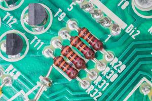 Condensers and Resistor assembly on the circuit board photo