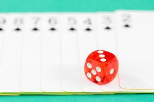 Dices and cards on green casino table photo