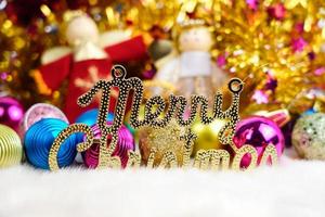 Chrismas doll with Christmas ornaments and decorations photo