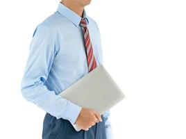 Businessman holding a laptop with clipping path photo