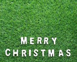 Christmas alphabet on green grass photo