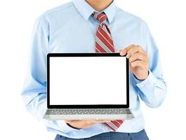 Businessman holding a laptop with clipping path photo