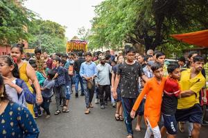 New Delhi, India July 01 2022 - A huge gathering of devotees from different parts of Delhi on the occasion of ratha yatra or rathyatra. Rath for Lord Jagannath pulled by people, Jagannath Rath Yatra photo