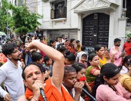 New Delhi, India July 01 2022 - A huge gathering of devotees from different parts of Delhi on the occasion of ratha yatra or rathyatra. Rath for Lord Jagannath pulled by people, Jagannath Rath Yatra photo