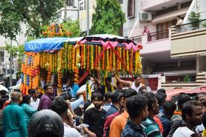 New Delhi, India July 01 2022 - A huge gathering of devotees from different parts of Delhi on the occasion of ratha yatra or rathyatra. Rath for Lord Jagannath pulled by people, Jagannath Rath Yatra photo