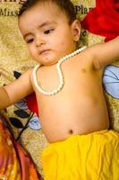 Cute Indian Kid dressed up as little Lord Krishna on the occasion of Radha Krishna Janmastami Festival in Delhi India photo