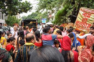 New Delhi, India July 01 2022 - A huge gathering of devotees from different parts of Delhi on the occasion of ratha yatra or rathyatra. Rath for Lord Jagannath pulled by people, Jagannath Rath Yatra photo