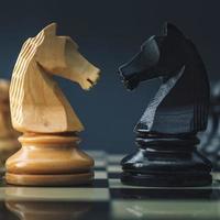 Small chess pieces and a chessboard photo