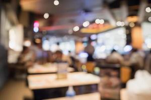 People in restaurant cafe interior with bokeh light blurred customer abstract background photo