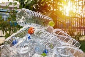 plastic bottles in brown recycle garbage box photo